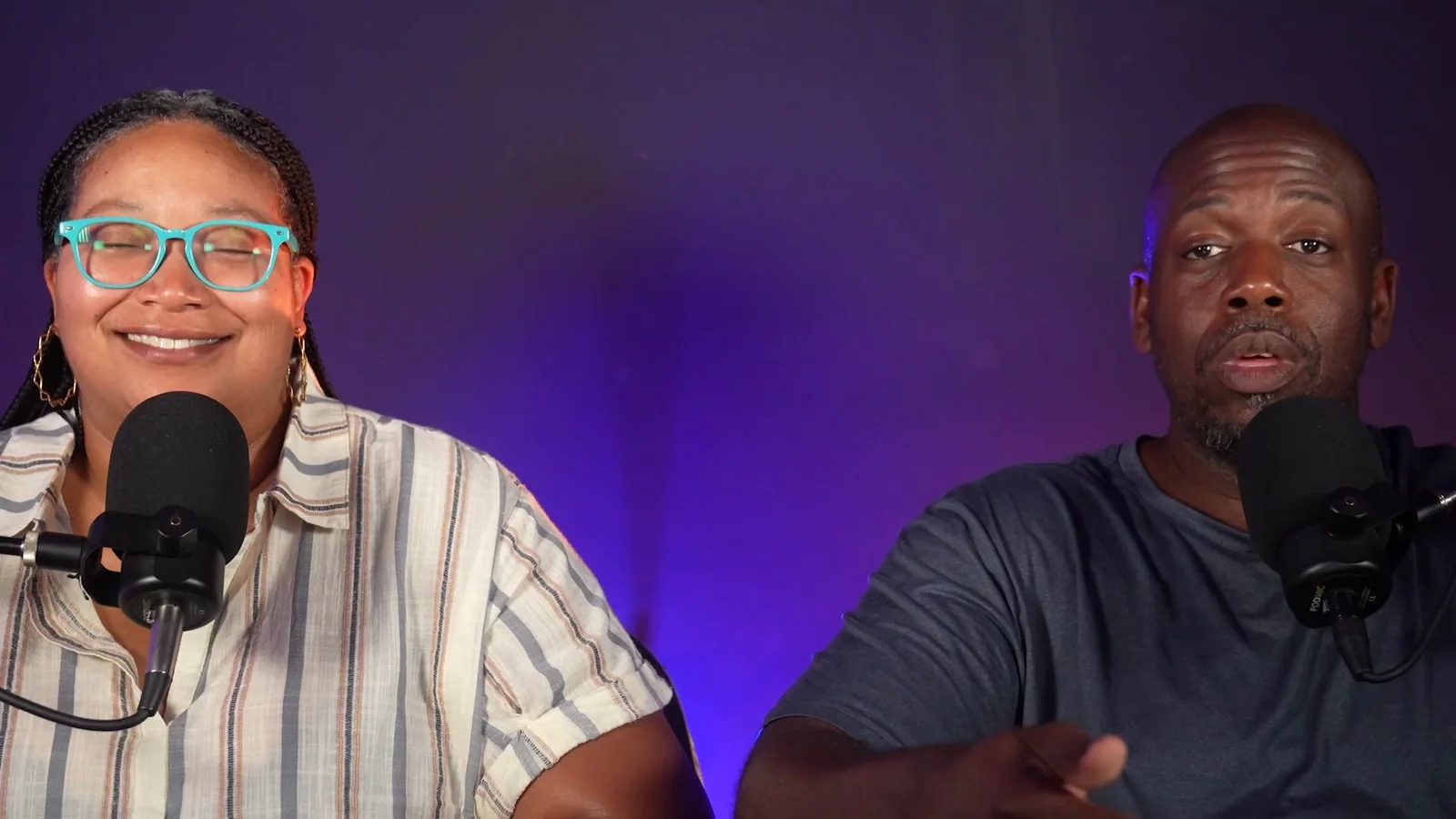The two OBK hosts at their podcast microphones